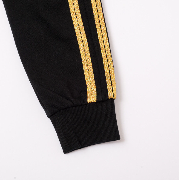 Pantaloni bande al lato oro