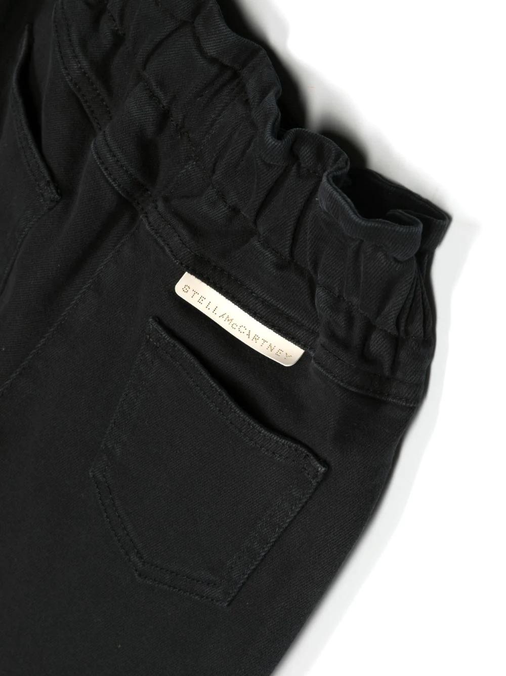 Pantaloni con applicazione