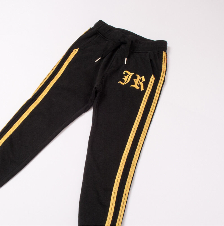 Pantaloni bande al lato oro