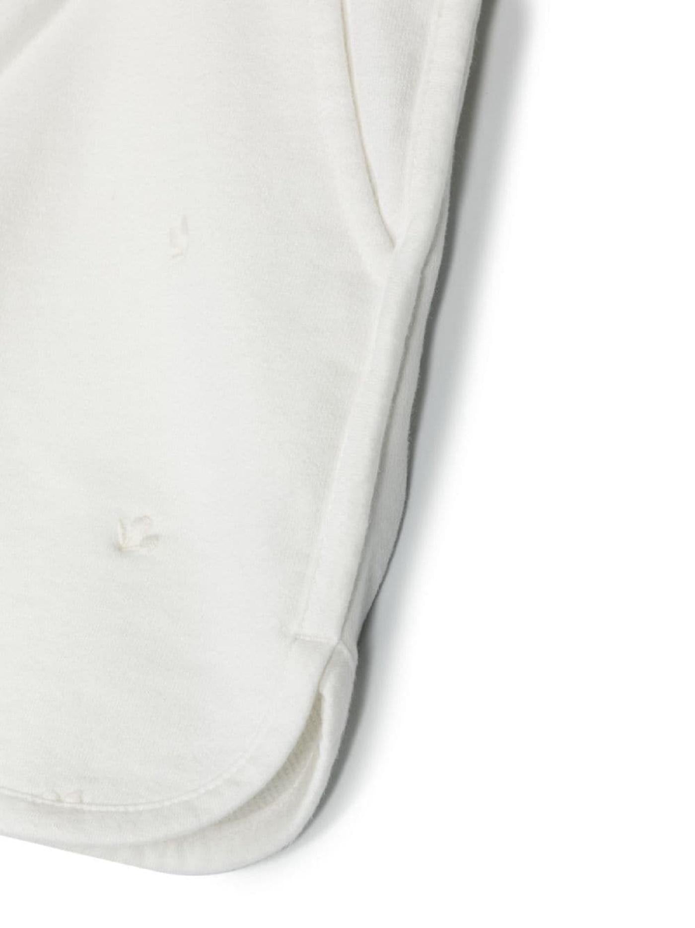 Shorts con ricamo